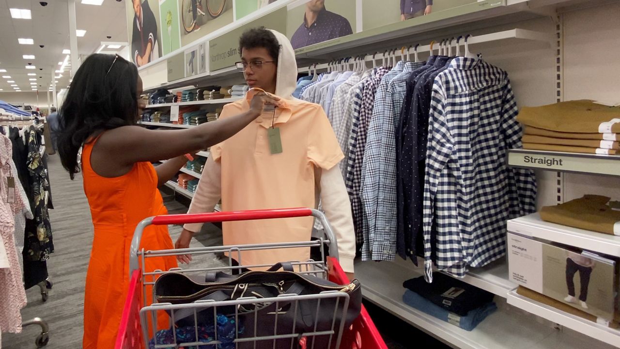 Thirteen-year-old Soloman Collier and his mother Teia shop for back-to-school clothes. (Spectrum News 1/Lupe Zapata)